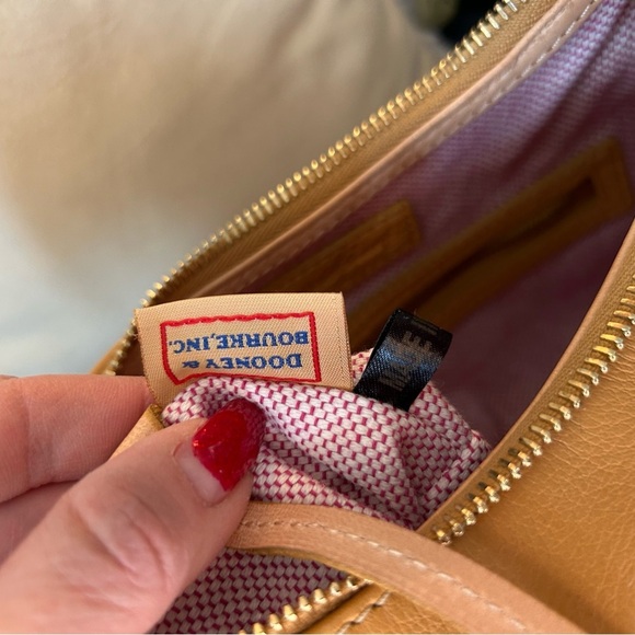 Dooney and Bourke Bag . Medium sized. Has imperfections . - Picture 8 of 17